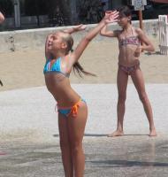 Italian girls dancing at the beach