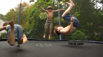 three boy on a trampoline